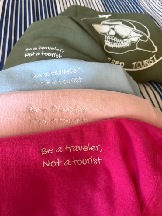 “Be a Traveler, Not a Tourist” hoodie